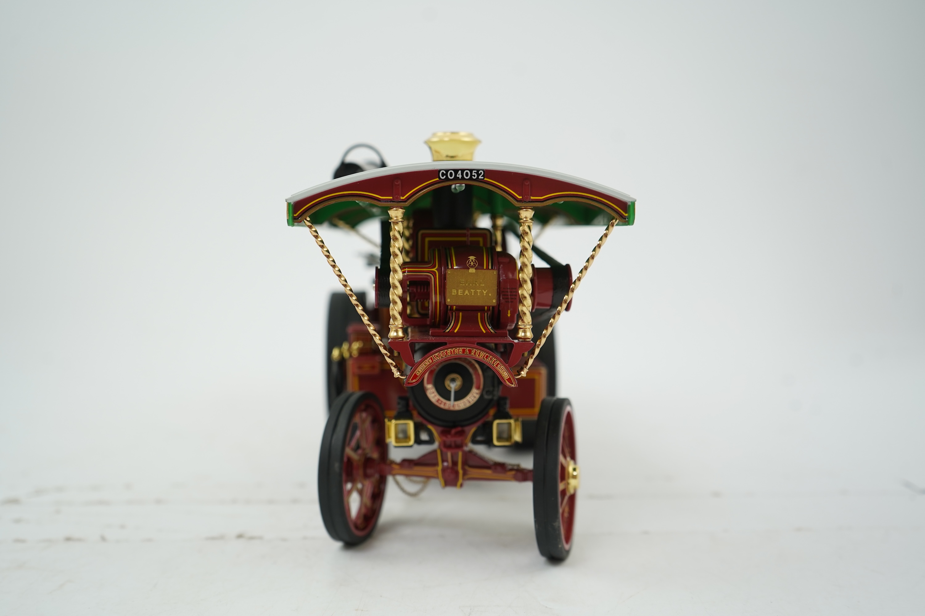 A Midsummer Models Ltd. 1:24 scale model of a Burrell Showman’s Engine, Earl Beatty, in ‘Anderson & Rowland’s Jungle Speedway’ livery, missing the original card box, but with an oak and Perspex display case